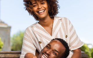 Outdoor protrait of black african american couple embracing each other
